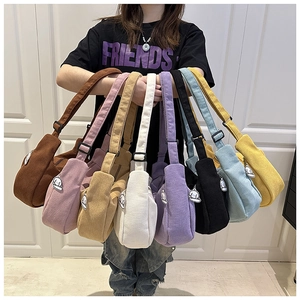 Detailed display of corduroy dumpling bags in eight colors with cute puppy charms