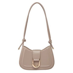 Minimalist beige crescent shoulder bag with golden U-shaped buckle and cord strap
