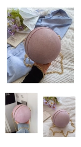 Detail of round straw evening bag in dusty pink with gold chain strap and zipper