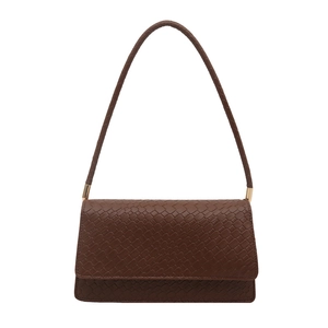 Minimalist dark brown woven shoulder bag with golden metal hardware and rectangular flap