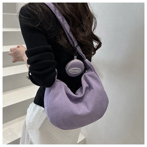 Detail of light purple corduroy hobo bag with matching mini round coin purse pendant