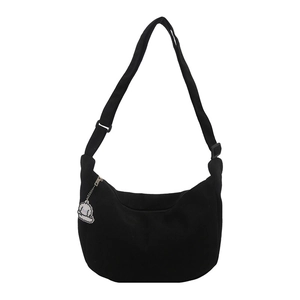Minimalist black corduroy crescent crossbody bag with a cute white puppy pendant
