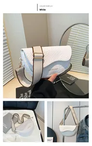 White crocodile pattern saddle bag featuring wide canvas strap and fashion gold lettering