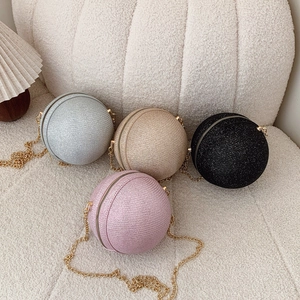 Sparkly spherical evening bags in silver gold pink and black with metal chain straps