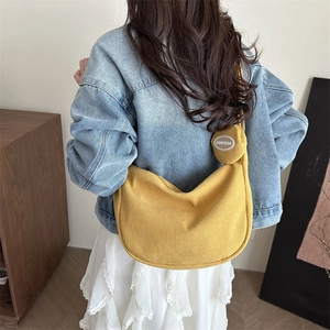 Ginger yellow corduroy half-moon crossbody bag with a mini round pouch pendant for women