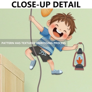 Detail of embossed texture on a cartoon boy climbing wall sticker for kids' rooms