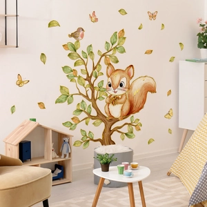 Detail view of cartoon squirrel and bird wall stickers in a cozy nursery room setting