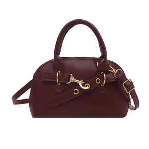 Minimalist burgundy faux leather shell bag with gold hardware and top handles
