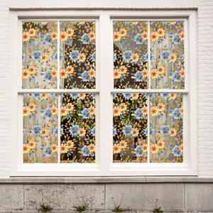 Close-up of static cling window film with colorful floral pattern and gold foil accents