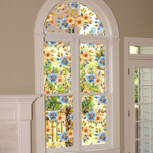Detailed view of floral glass window film featuring blue and orange blossoms on an arched window