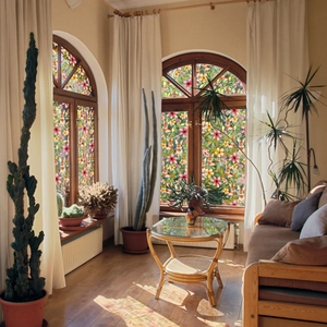Detail of floral rabbit static window film on arched window for home privacy and decor