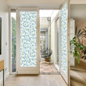 Close-up of white daisy floral static window film on glass door for privacy and decor