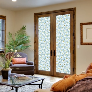 Close-up of static daisy flower window stickers on a wooden glass door in home decor