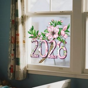 Dettaglio dell'adesivo statico 2026 con fiori rosa su una finestra in vetro residenziale