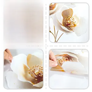 Detail of floral static window film with gold edges showing front and reverse sides