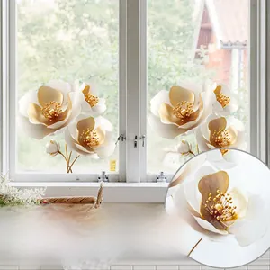 Close-up of golden floral static window stickers with pearlescent petal texture detail