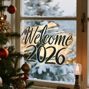 Detail of 2026 Welcome window sticker with gold artistic brush strokes on snowy glass