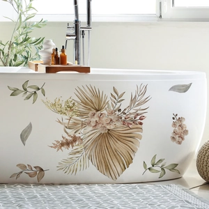 Detail of bohemian floral bathtub stickers featuring palm leaves and orchids in earth tones
