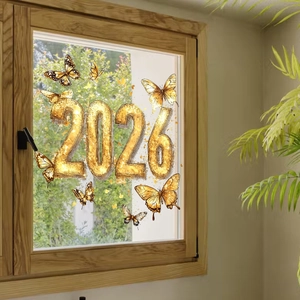 Detail of 2026 window sticker featuring golden butterflies and artistic gold lettering