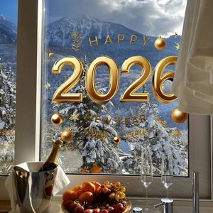 3D golden Happy 2026 New Year static window decal with stars on a snowy window background