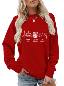 Detail of red crewneck sweatshirt featuring white screen printed tea and books graphic