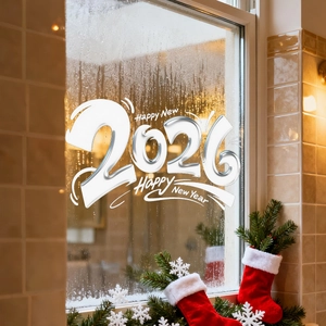 Macro shot of 2026 Happy New Year butterfly floral static window stickers on a glass surface