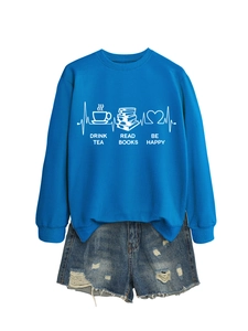Detail of screen-printed Drink Tea Read Books Be Happy slogan on a blue sweatshirt