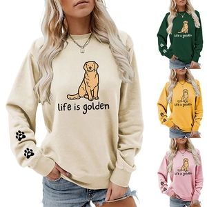 Close-up of paw print on sleeve and golden retriever graphic on casual crewneck sweatshirt
