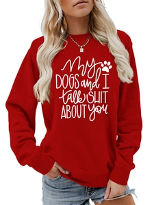 Detail of red crewneck sweatshirt with My dogs and i talk shit print and ribbed cuffs