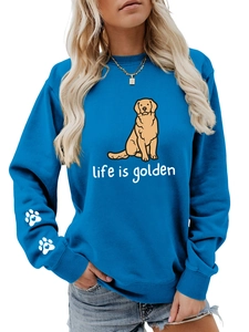 Detail of blue crewneck sweatshirt with golden retriever print and white heart on sleeve