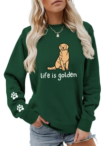 Detail of dark green crewneck sweatshirt with golden retriever print and sleeve paw prints
