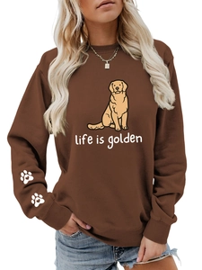 Close-up of heart-shaped paw print design on the sleeve of a brown golden retriever sweatshirt
