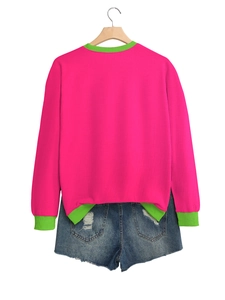 Back view of pink pullover sweatshirt with green ribbed trim and denim shorts set