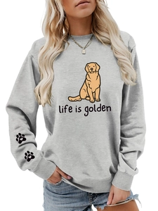Detail of grey crewneck sweatshirt featuring golden retriever print and heart paw on sleeve