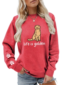 Detail of red sweatshirt showing Life is Golden print and heart paw sleeve graphics