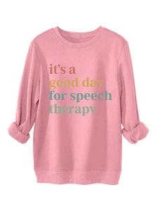 Detalle de sudadera rosa con estampado de it's a good day for speech therapy