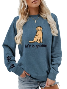 Detail of teal crewneck sweatshirt with heart-shaped paw prints on the right sleeve