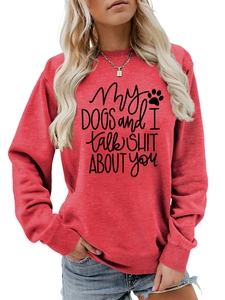 Detail of red crewneck sweatshirt with 'My dogs and I talk shit about you' text print