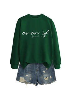 Detail of dark green crewneck sweatshirt with 'even if' text and distressed denim shorts