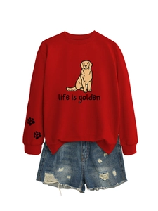 Detail of red crewneck sweatshirt featuring golden retriever print and sleeve paw embroidery