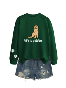 Detail of sleeve cuff with white paw prints and golden retriever graphic on sweatshirt