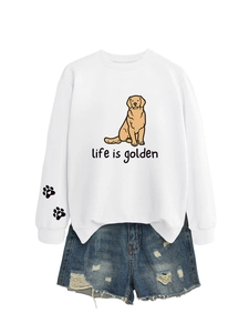 Detail of white crewneck sweatshirt featuring golden retriever print and life is golden text