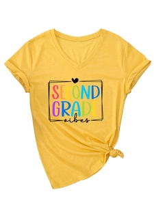 Detail of yellow V-neck tee with Second Grade vibes print and stylish front hem knot