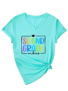 Detail of mint green V-neck T-shirt with Second Grade Vibes graphic and knotted hem