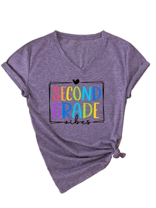 Detail of V-neck purple t-shirt featuring SECOND GRADE vibes print and a knotted hem