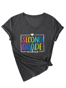 Detailed view of the colorful Second Grade Vibes print on a dark gray V-neck cotton T-shirt