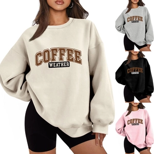 Close-up of Coffee Weather vintage print on oversized cream sweatshirt with color options