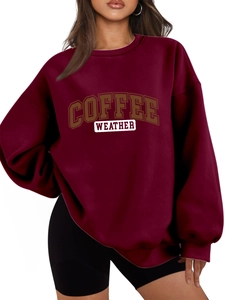 Detail of burgundy oversized sweatshirt with COFFEE WEATHER print and drop shoulder