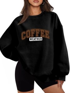 Detail shot of the ribbed cuff and high-quality cotton fabric on a black sweatshirt