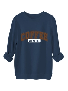 Close-up of the ribbed crewneck and COFFEE WEATHER text on the dark blue thick sweatshirt